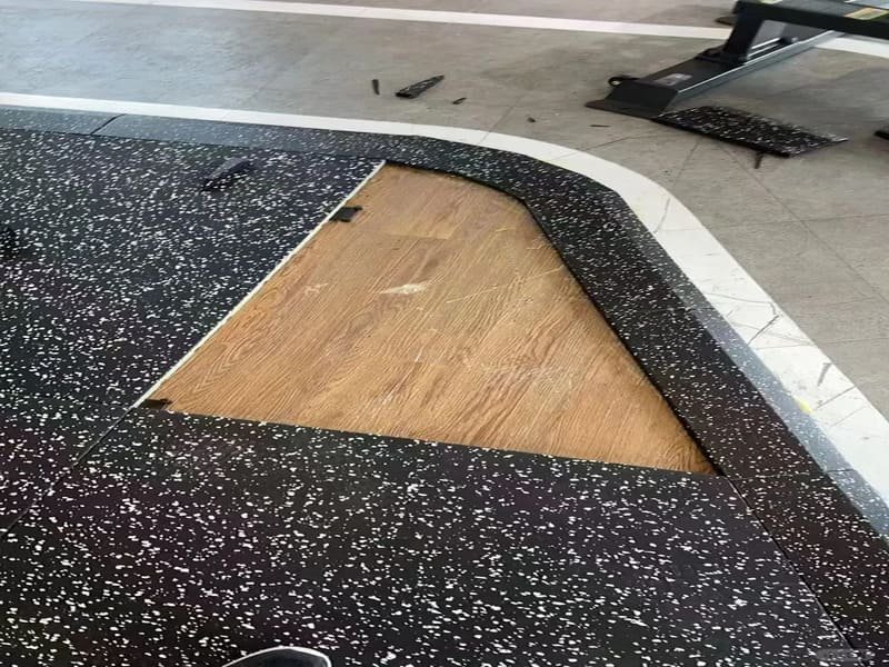 rubber flooring rolls sitting in a climate controlled gym for acclimatization